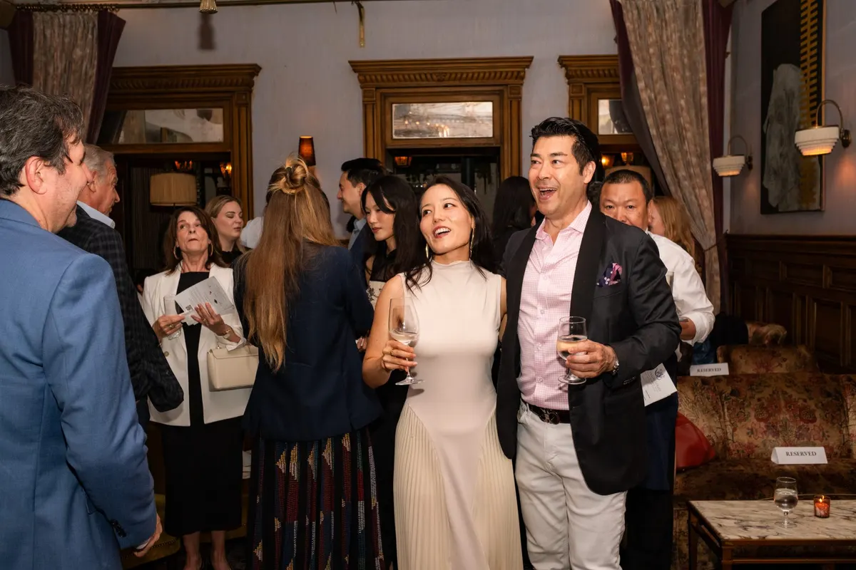 Guests laughing in the Lobby Bar