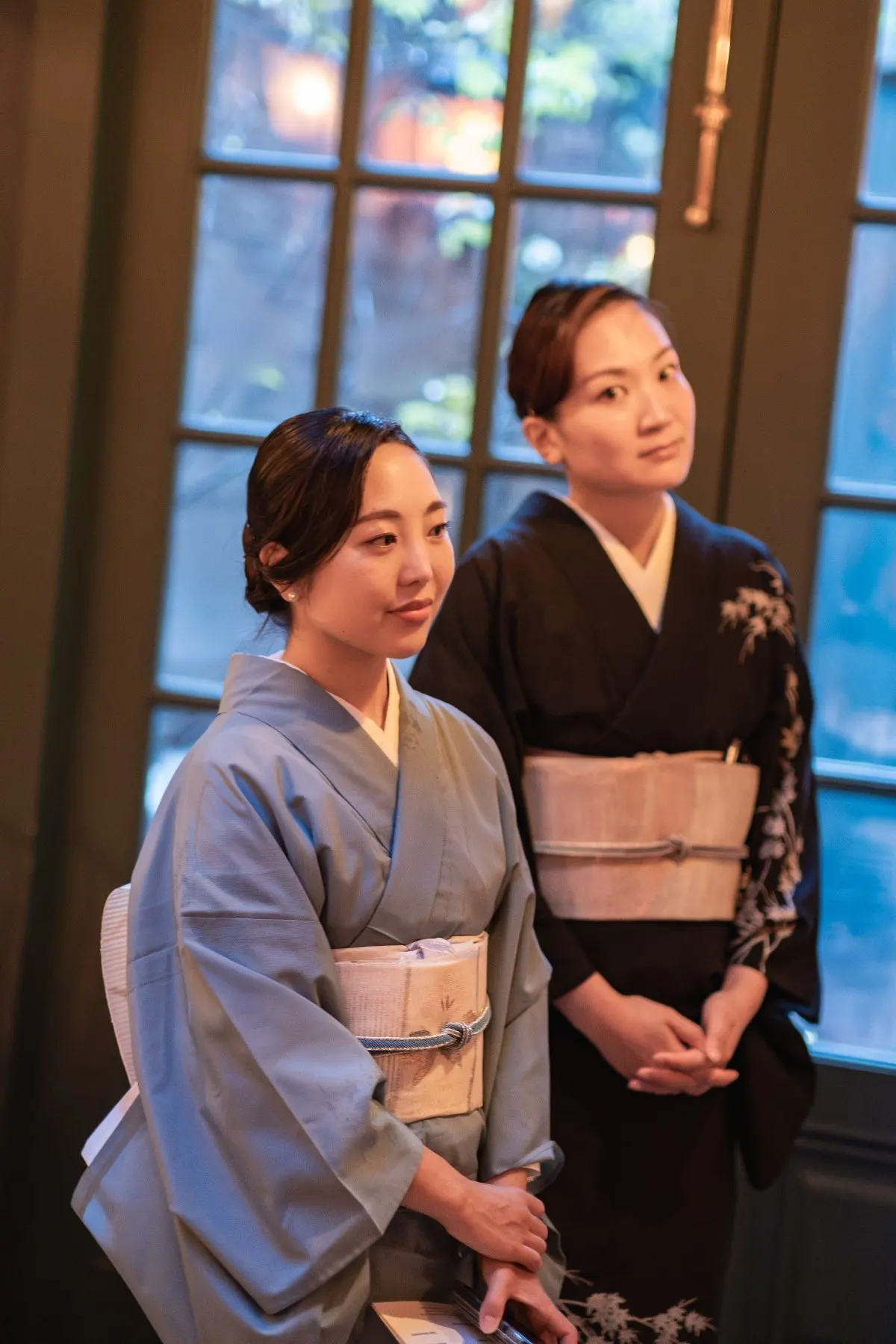Two guests in kimono by the window