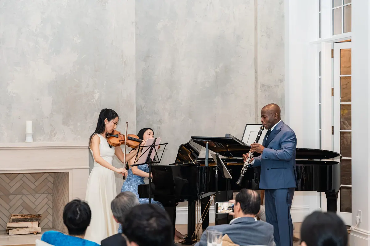 Risa, Rieko and Anthony playing together, the audience in front