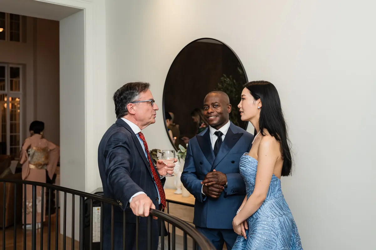 Rieko Tsuchida and Anthony McGill talking with a guest